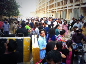 Express Media group employees evacuate the Karachi office